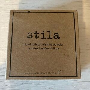 Stila cosmetics 
Gold Illuminating finishing Powder